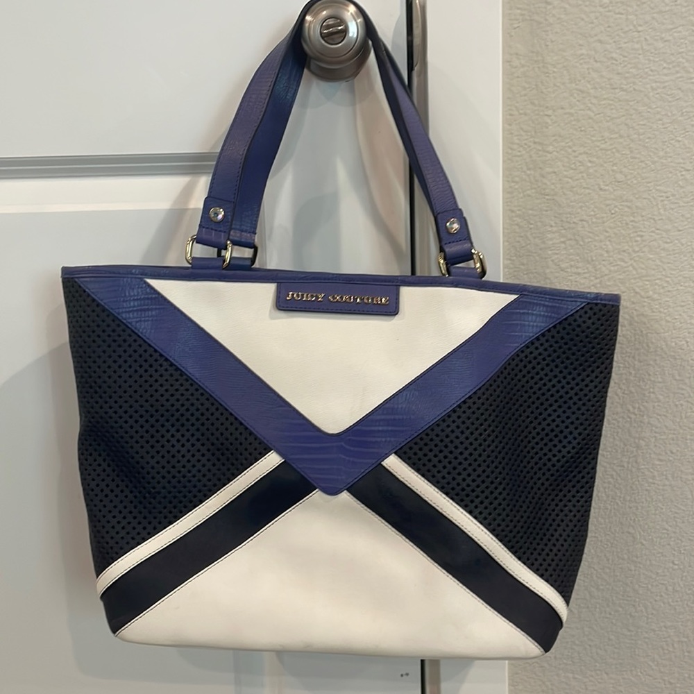 Purple and white Juicy Couture handbag with textured details.